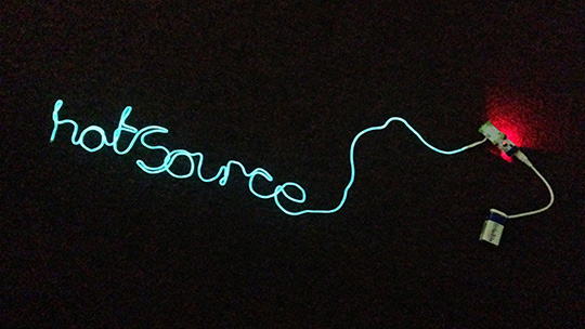 Hot Source spelled out in lights